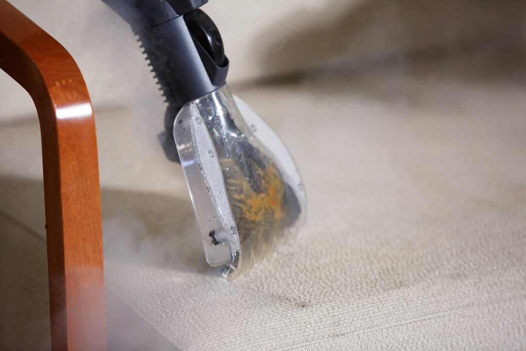 cleaning upholstery and padded sofa chairs with a steam cleaner with suction function