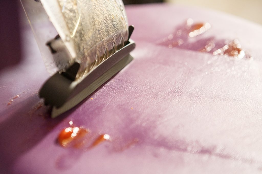 cleaning a couch with a steam cleaner with suction function